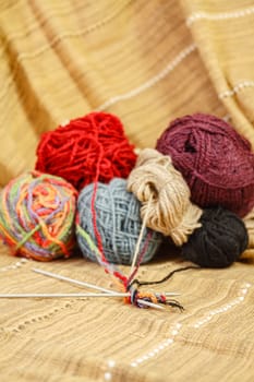 Balls of colored yarn for knitting. Selective focus with shallow depth of field.