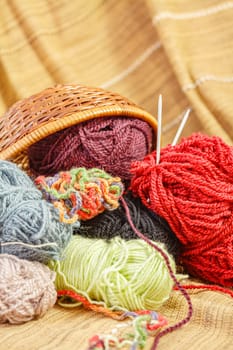 Balls of colored yarn for knitting. Selective focus with shallow depth of field.