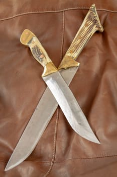 Hunting knife with antler handle. Selective focus with shallow depth of field.