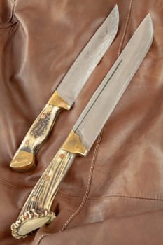 Hunting knife with antler handle. Selective focus with shallow depth of field.