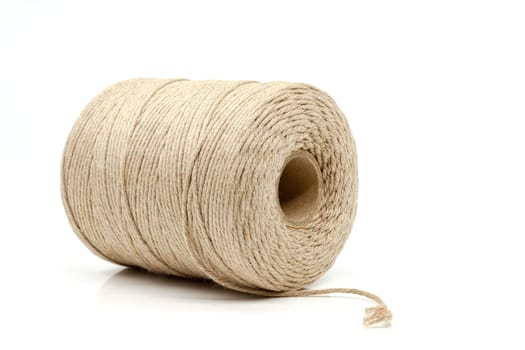 A spool of natural cotton twine with a wide range of applications. Selective focus with shallow depth of field.
