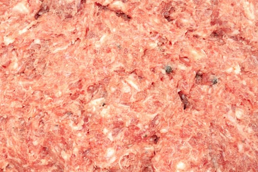 Fresh minced beef and pork with cooking spices close up view.
