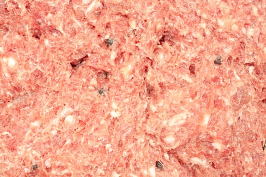 Fresh minced beef and pork with cooking spices close up view.