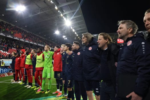Jumping,cheering and celebrating in their own fan corner after the 1-1 draw at SC Freiburg: Coach Bo Henriksen (FSV Mainz 05) and the games after the match of the 1st FBL: 23-24: 30. Sptg. SC Freiburg - FSV Mainz 05  DFL REGULATIONS PROHIBIT ANY USE OF PHOTOGRAPHS AS IMAGE SEQUENCES AND/OR QUASI-VIDEONann  Photo: Joachim Hahne/johapress