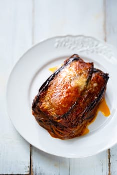 Close up of a plate of rustic italian eggplant parmigiana