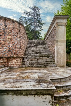 Stone staircase and weathered walls in the tranquil courtyard of the historic Beykoz Mecidiye Pavilion, Istanbul, Turkey