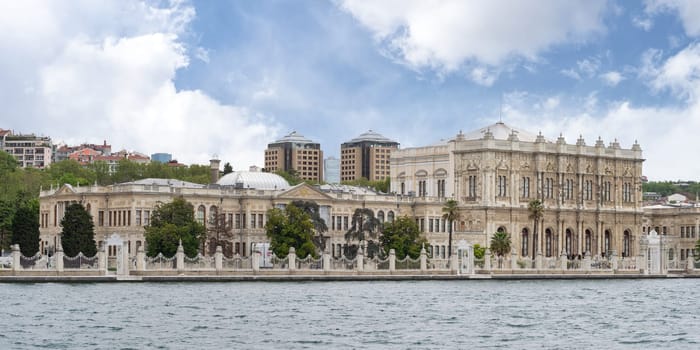 View from Bosporus strait of Dolmabahce Palace, or Dolmabahce Sarayi, located in Besiktas district on the European coast of Istanbul, Turkey