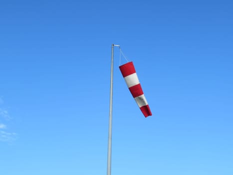 red and white wind indicator safety signal warning