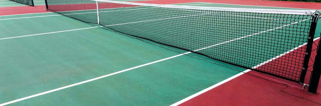 Tennis court with netting, close-up. Sport background