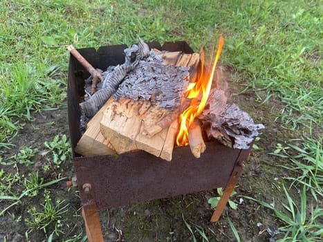 The barbecue grill is lit for the cooking outdoors