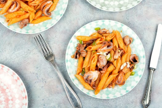 Delicious macaroni or pasta with octopus. Macaroni with seafood. American appetizer.