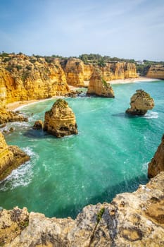 Vertical photography of spectacular cliffs near Marinha beach and Benagil in Algarve, Portugal