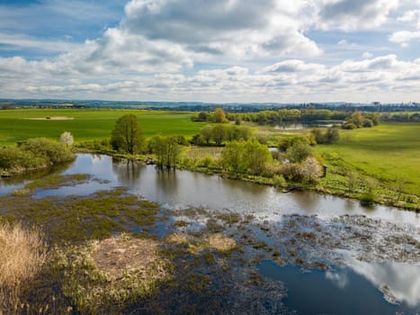 Flight just above the water, Beautiful spring landscape with small pond. Europe highland countryside. Czech Republic