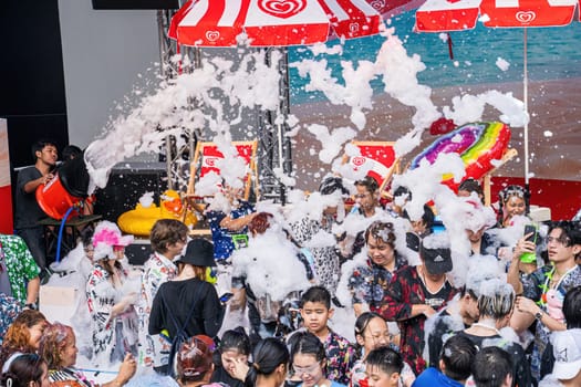 Siam Square, Bangkok, Thailand - APR 13, 2024 Songkran Festival, The short action of people joins celebrations of the Thai New Year or Songkran in Siam Square Bangkok, Thailand.