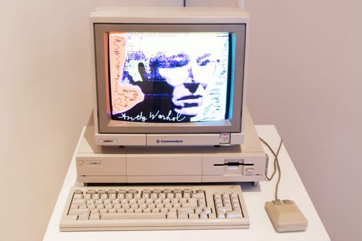 Venaria Reale, Italy - October 2022: Computer Commodore Amiga 1000 with floppy disk, mouse, beige