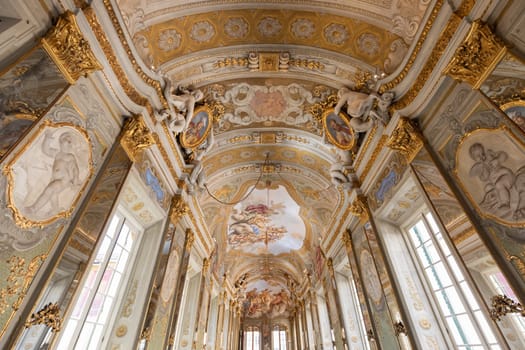 Genova, Italy - 6 August 2023: Royal Palace museum interior. Luxury marble, gallery with windows and mirrors.