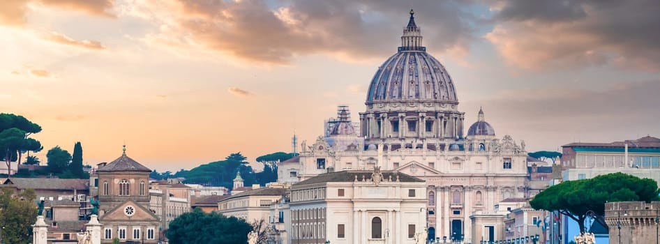 ROME, ITALY - JUNE 2023: Tiber river bridge with Vatican City and dome of Saint Peter Cathedral