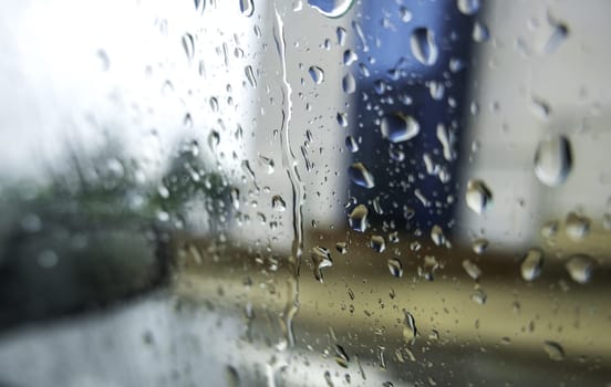Detail of wet car window on cold winter rainy day
