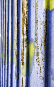Detail of rusty and abandoned metal door, ruin