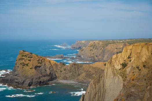 View on the dramatic western coastline, Vicentine Coast, of the Algarve in Portugal, location: Arrifana