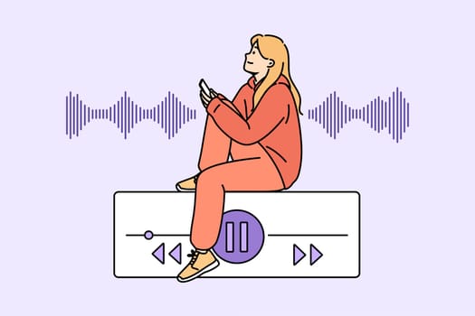 Teenage woman listens to music on phone, sitting near equalizer on buttons to control playlist. Music lover girl uses audio application on smartphone to play favorite songs or audio books