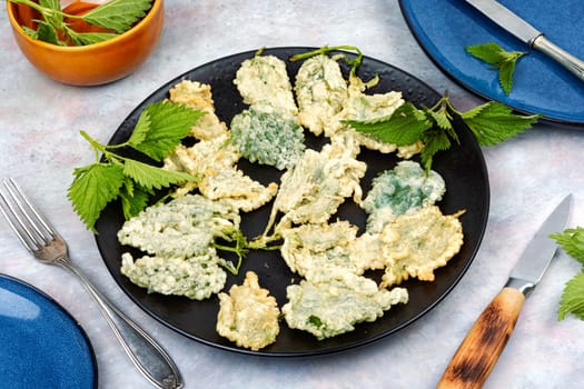 Breaded nettle or battered nettle. Hot spring greens appetizer