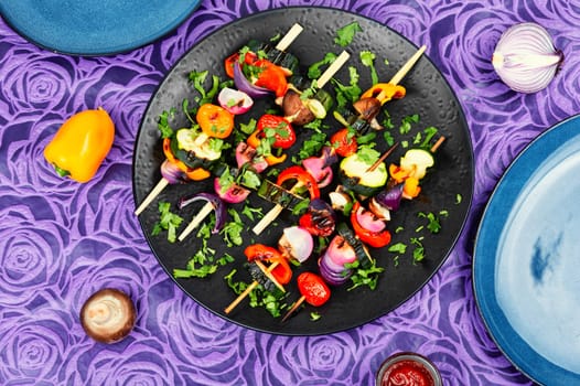 Vegan shashlik of fresh vegetables on wooden skewers. Copy space. Space for text.