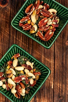 Mix of nuts on a old retro wooden background