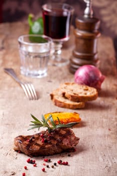 closeup of a rosemary leaf on a steak