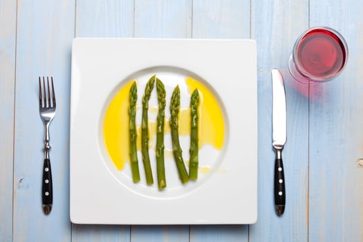 green asparagus on a white plate