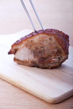 roasted pork ready to be sliced