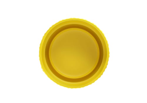 Yellow plastic bottle caps isolated on white background