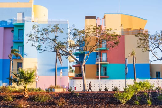 Albufeira, Portugal - April 28, 2024: Colorful buildings photographed from the street in the marina of Albufeira on the Algarve coast of Portugal