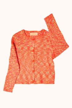 Girls clothes. Multi-colored knitted elegant fluffy cardigan or jumper with v-neck and button closure isolated. Clipping path. Kids and children's fashion.