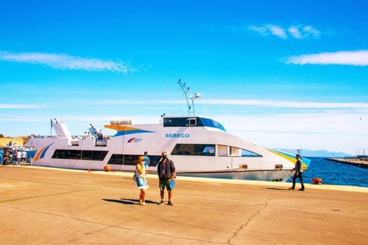 SYMI, Greece - JUN 03, 2021. The ship is moored in the harbour of Rhodes, belongs to the Sebeco Lines fleet and sails to the island of Symi. Space for 200 passengers.
