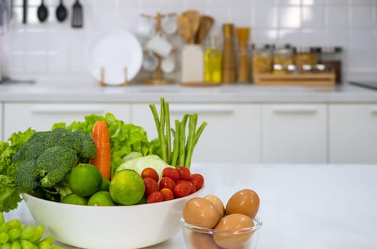 Healthy foods of fresh vegetables, fruits, eggs and pineaple juice on white table in home kitchen . Home healthy lifestyle concept