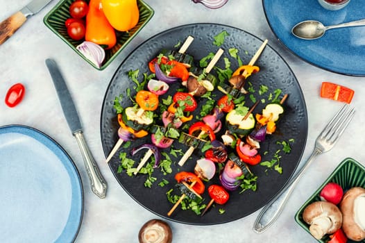 Vegan shashlik of fresh vegetables on wooden stick.