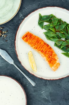 Seared salmon steak with green bean. Top view.