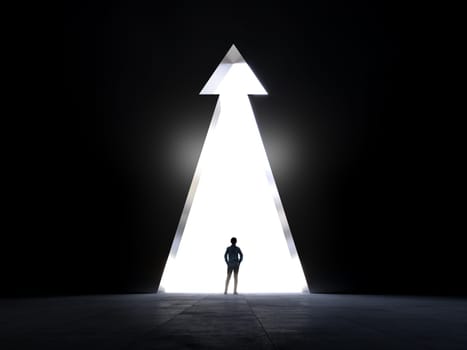 Back view of a person standing before a luminous arrow symbolizing direction