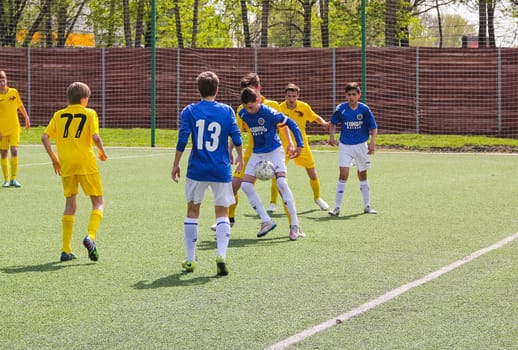 Russia, Volgodonsk - may 17, 2015: Football game. Training matches junior teams and fans
