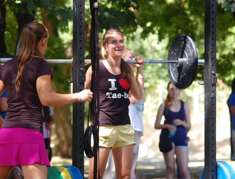 Russia, Volgodonsk - may 17, 2015: Training over the bar. Weight lifting exercise with weights