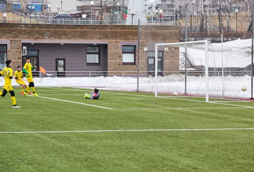 Russia, Volgodonsk - may 17, 2015: Football game. Training matches junior teams and fans