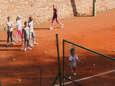 A child playing badminton. Yard games children.