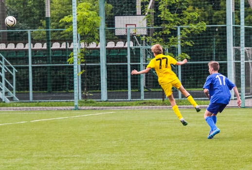Russia, Volgodonsk - may 17, 2015: Football game. Training matches junior teams and fans