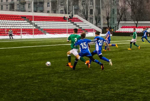 Russia, Volgodonsk - may 17, 2015: Football game. Training matches junior teams and fans