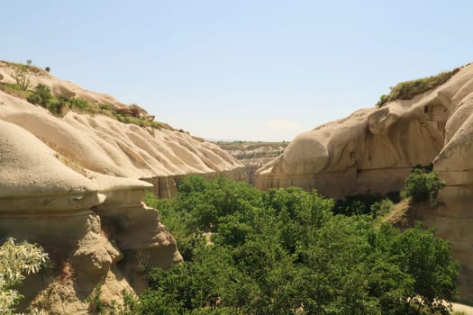 View into the Pigeon Valley, Güvercinlik Vadisi between Göreme and Uchisar with its dense vegetation, Cappadocia, Turkey 2022