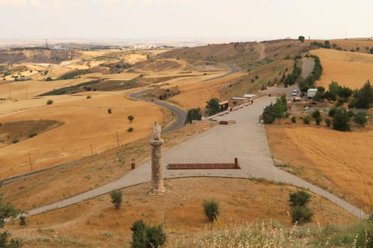 View from Karakus Tumulus, memorial grave of the Commagene Royal Family onto the surrounding landscape with the entrance area in the foreground, close to Adiyaman, Turkey 2022