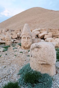 Heads of stone statues, sculptures on the West Terrace of Mount Nemrut, heads Apollo, Zeus and an eagle, close to Adiyaman, Turkey 2022
