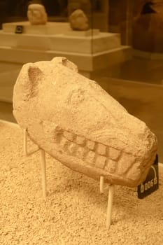 Neolithic stone sculpture, statue of a cat, feline, predator head, found in the area of Göbekli Tepe and displayed in the Sanliurfa Museum, Sanliurfa, Turkey 2022
