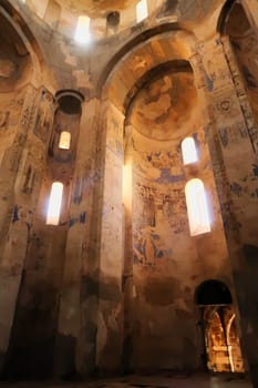 The interior of the Armenian Cathedral of the Holy Cross, vaults, christian orthodox wall paintings and frescos and the entrance door, Akdamar Island, Lake Van, Turkey 2022